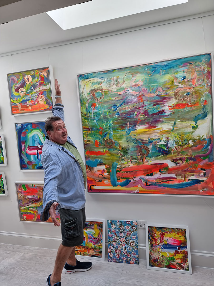 Martin Bush in studio with large painting